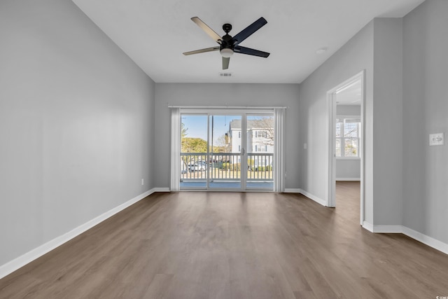 901 W Port Dr Unit 1706, North Myrtle Beach, SC 29582 - empty room with baseboards, a ceiling fan, visible vents, and wood finished floors