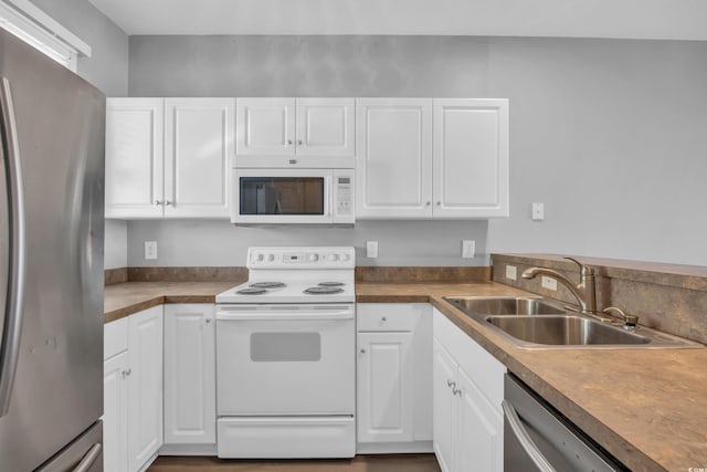 901 W Port Dr Unit 1706, North Myrtle Beach, SC 29582 - kitchen with stainless steel appliances, white cabinets, and a sink