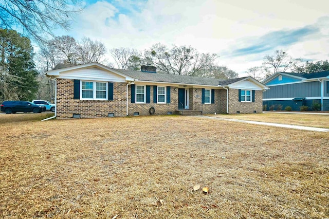 ranch-style home with a front lawn