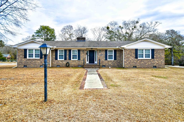 ranch-style home featuring a front yard