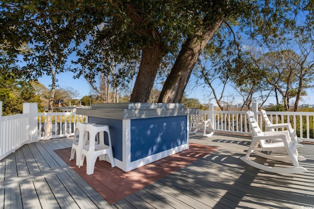 wooden terrace featuring a bar