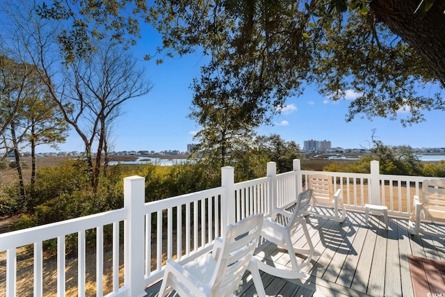 wooden deck featuring a water view