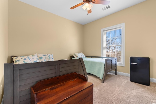 bedroom with light carpet and ceiling fan