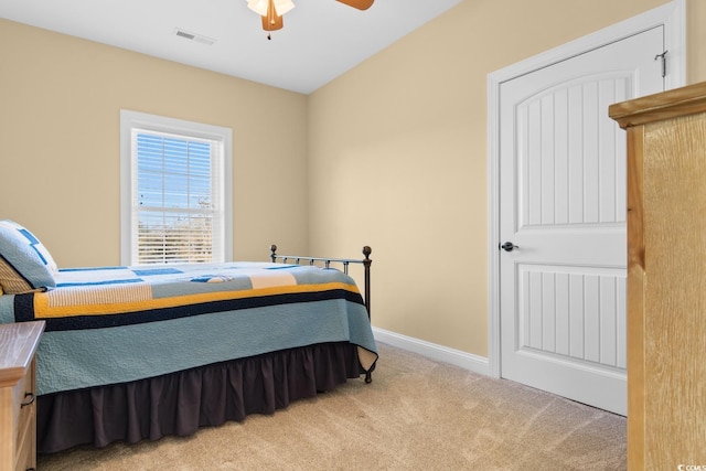 carpeted bedroom with ceiling fan