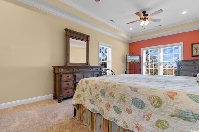 bedroom featuring multiple windows, ceiling fan, ornamental molding, and light carpet