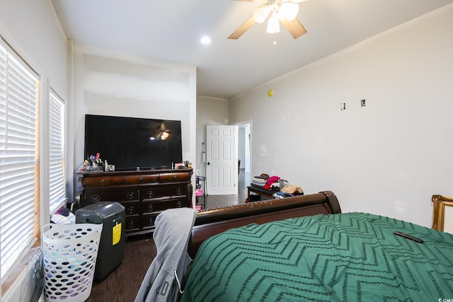 bedroom featuring crown molding, ceiling fan, and wood finished floors