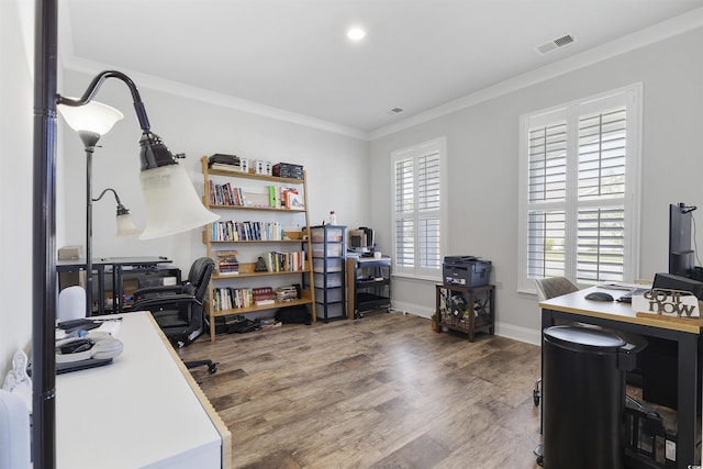 office space with hardwood / wood-style floors and crown molding