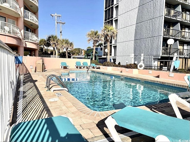 view of pool featuring a patio area