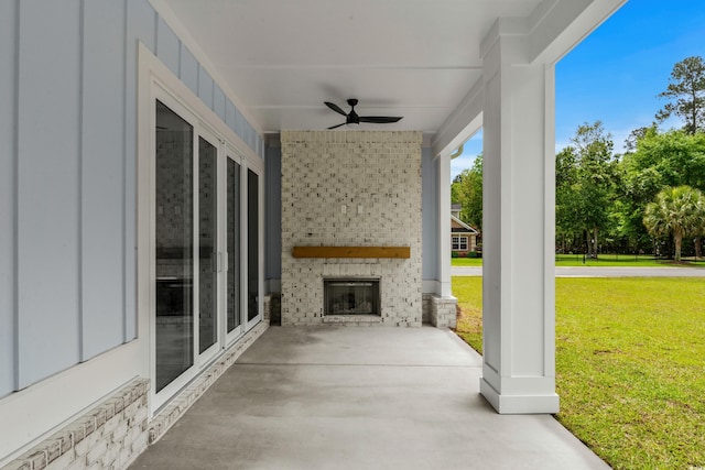 7053 Byrnes Ln, Myrtle Beach, SC 29588 - view of patio featuring a ceiling fan and an outdoor brick fireplace