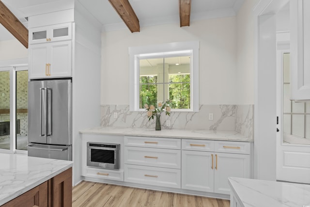 7053 Byrnes Ln, Myrtle Beach, SC 29588 - bar with beam ceiling, light wood-style floors, high end fridge, and backsplash