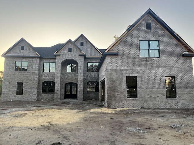 7053 Byrnes Ln, Myrtle Beach, SC 29588 - french country inspired facade with brick siding