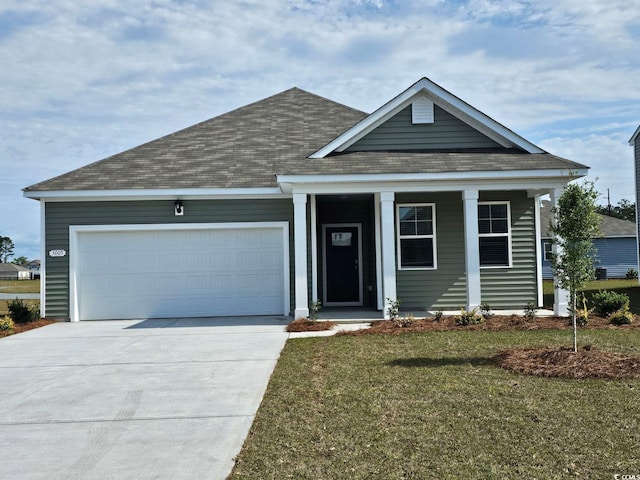 view of front facade featuring a garage and a front yard