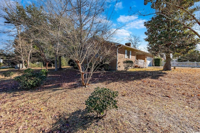 1020 Thomas Ave, North Myrtle Beach, SC 29582 - view of yard featuring fence and a garage