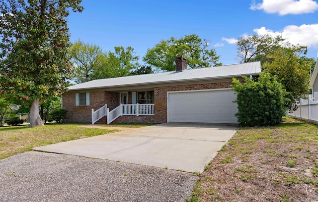 1020 Thomas Ave, North Myrtle Beach, SC 29582 - single story home featuring a garage, a chimney, driveway, brick siding, and a front lawn