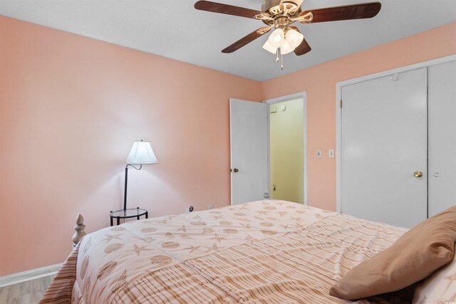 1020 Thomas Ave, North Myrtle Beach, SC 29582 - bedroom with wood finished floors, baseboards, a closet, and a ceiling fan