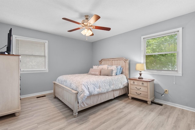 1020 Thomas Ave, North Myrtle Beach, SC 29582 - bedroom with light wood-style flooring, baseboards, and ceiling fan