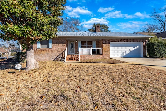 single story home with a garage, a porch, and a front lawn