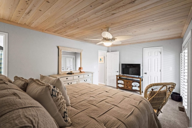 bedroom with ornamental molding, ceiling fan, wood ceiling, and light colored carpet