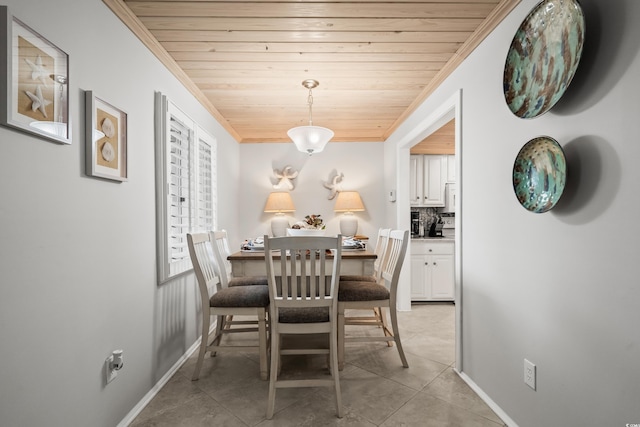 tiled dining area featuring wooden ceiling and ornamental molding