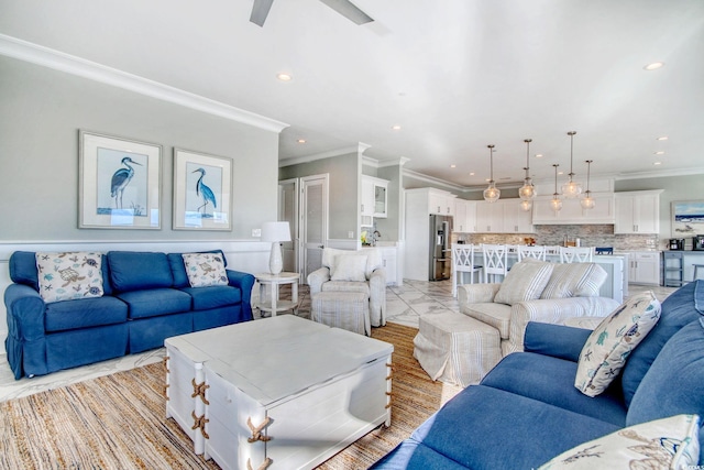 living area with a ceiling fan, recessed lighting, marble finish floor, and crown molding