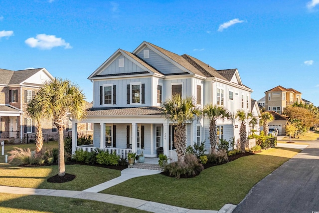 view of front of house featuring a front yard and covered porch