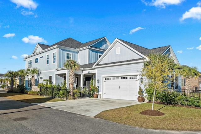 view of front of property featuring a garage and a front lawn