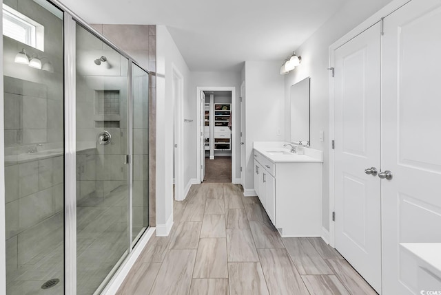 bathroom featuring vanity and walk in shower