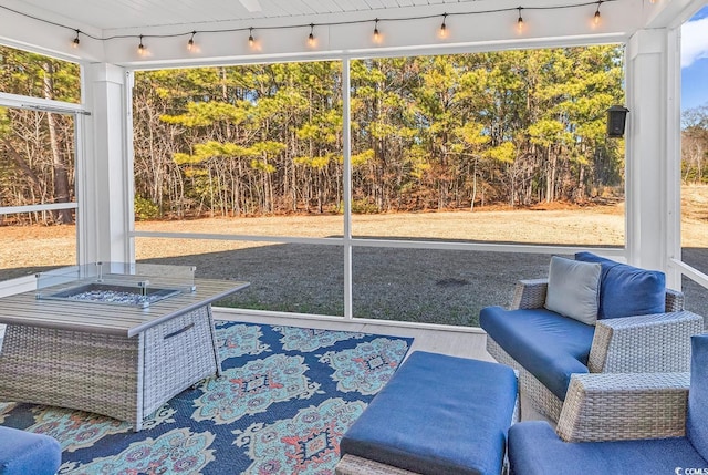 sunroom / solarium featuring a healthy amount of sunlight