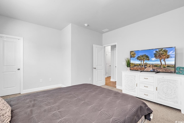 bedroom with light colored carpet