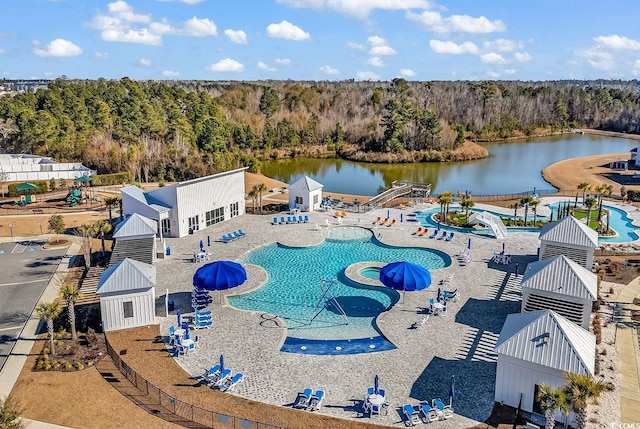 birds eye view of property with a water view