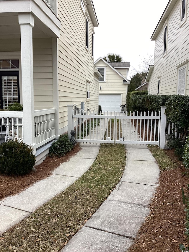 view of side of home featuring a garage