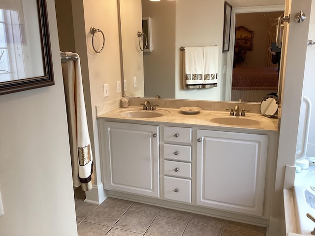 bathroom with tile patterned flooring and vanity