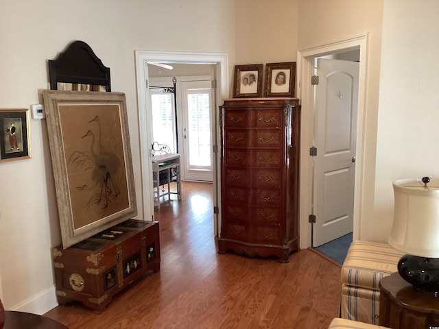 hall with dark hardwood / wood-style flooring