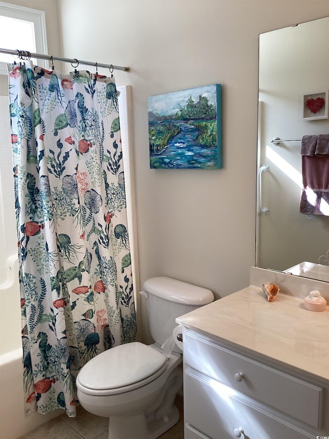 full bathroom featuring tile patterned flooring, vanity, shower / bath combo with shower curtain, and toilet