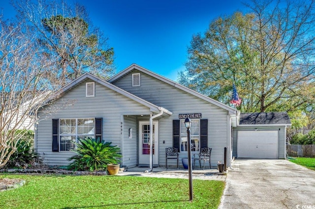 view of front of house with a garage and a front lawn