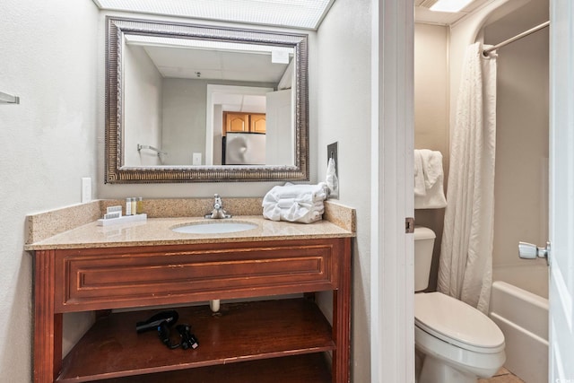 full bathroom with shower / bathtub combination with curtain, vanity, and toilet