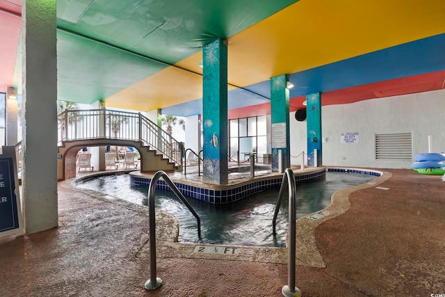 view of swimming pool featuring a patio area