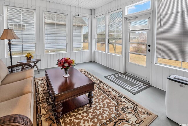 tiled dining area with ceiling fan with notable chandelier