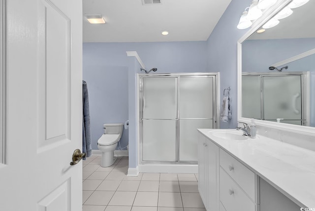 bathroom featuring tile patterned floors, toilet, an enclosed shower, and vanity