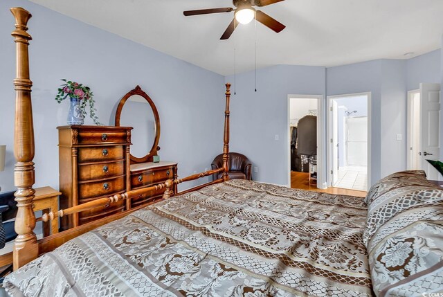 bathroom with tile patterned flooring, vanity, and walk in shower