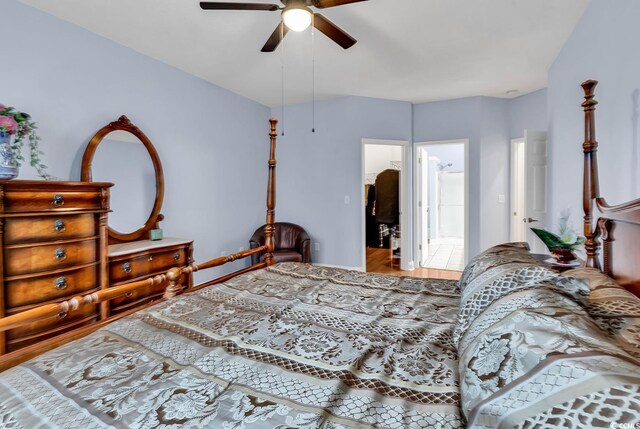 bedroom featuring ceiling fan and ensuite bathroom