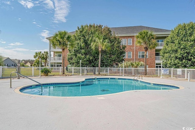 view of swimming pool featuring a patio area