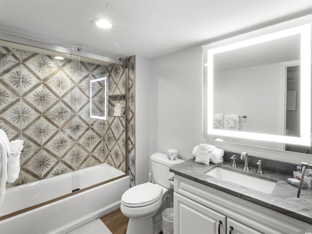 full bath featuring toilet, vanity, shower / bathtub combination, and wood finished floors