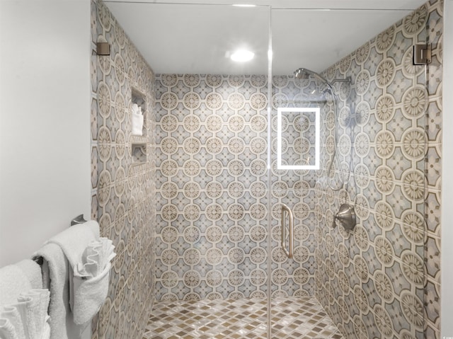 bathroom with tiled shower