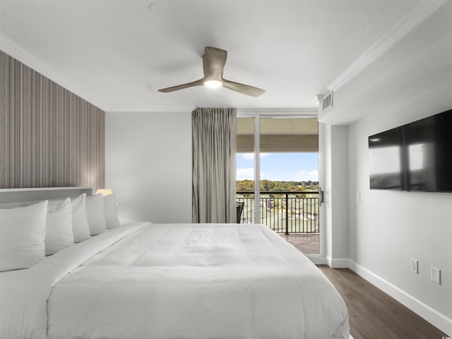 bedroom featuring baseboards, visible vents, dark wood finished floors, ornamental molding, and access to outside