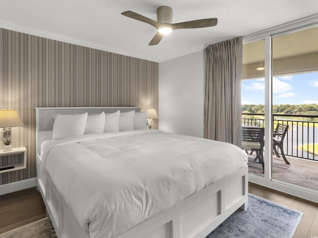 bedroom featuring a ceiling fan, wood finished floors, ornamental molding, floor to ceiling windows, and access to outside