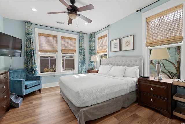 bedroom featuring ceiling fan and light hardwood / wood-style floors