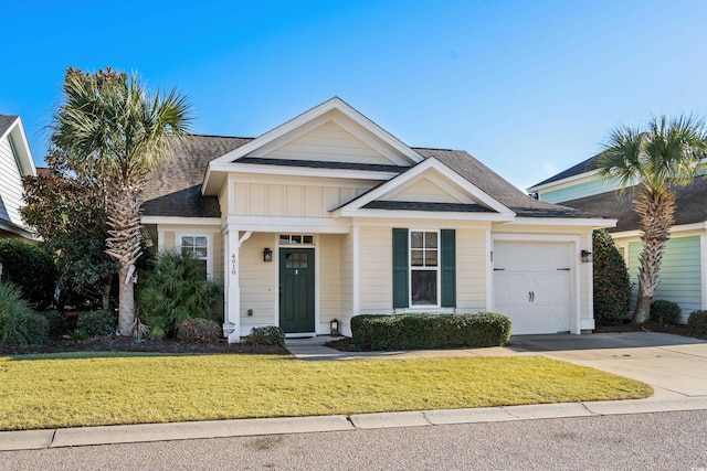 view of front of home featuring a garage and a front lawn