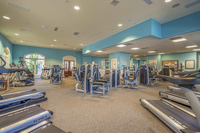 workout area featuring a drop ceiling