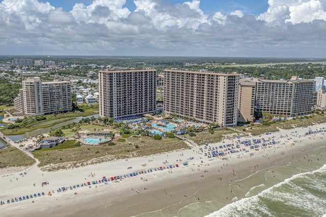 drone / aerial view with a view of the beach and a water view